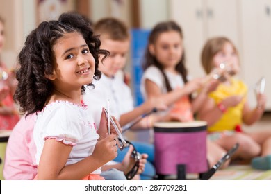 Preschool Students Playing Musical Instruments.