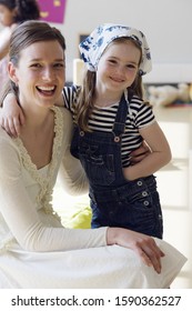 Preschool Teacher And Student Hugging