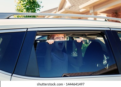 Preschooler Little Caucasian Girl Left Alone In Car During Hot Sunny Day. Child Crying Screaming Trying To Get Out Of Closed Vehicle At Summer. Children Safety Protection Kidnapping Concept.