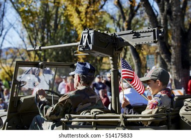 Prescott, Arizona, USA - November 11, 2016: Young Boy In Boy Scout Uniform Riding In Jeep Participating In Veterans Day Parade