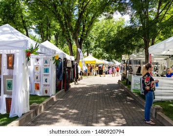 Prescott, AZ / USA - Circa August 2019: Farmers Market / Art / Craft at the fair at the Prescott courthouse on a beautiful summer day. People shopping and enjoying the warm crisp weather
