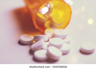 Prescription bottle with backlit Lorezapam tablets. Lorezapam is a generic prescription anti-anxiety medication. A concept for mental health.