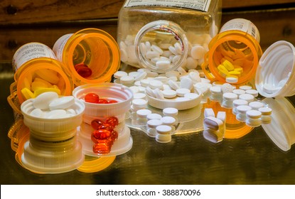 Prescription Drugs Spilled On Mirror Counter Reflecting Healthcare Medicare And Big Pharma In Pills Tablets And Gelcaps