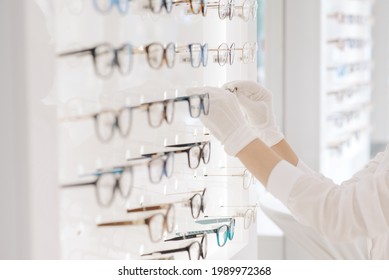 Prescription Glasses. Optician Chooses Eyeglass Frames In The Optical Salon.