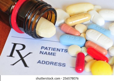 Prescription pills and prescription paper. Colorful medication pills