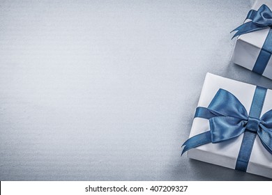 Present Boxes On Blue Background Greeting Card Holidays Concept.