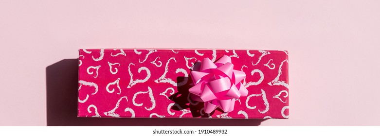 Present Or Gift Box, Paper Heart And Pink Bow Ribbon On Pink Background Top View. Valentines Day Greeting Card. Happy Valentine's Day Composition. Red Gift Box With Hearts.copy Space.