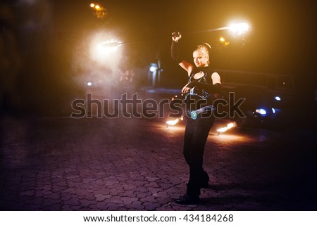 Presentable and awesome fire show at evening on wedding party.Photo with some noice