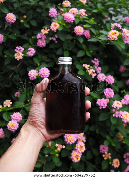 Download Presentation Cold Brew Glass Bottle Holding Stock Photo Edit Now 684299752 PSD Mockup Templates