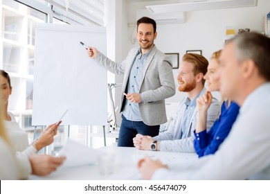 Presentation and collaboration by business people in office - Powered by Shutterstock