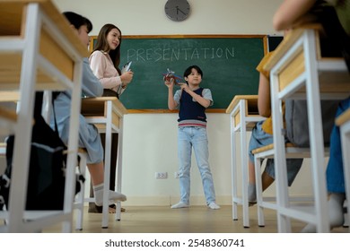 Presentation lesson, Teacher and students in the basic presentation in front of class