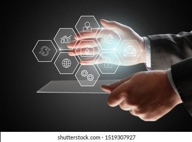 Presentation of project management areas of knowledge such as cost, time, scope, human resources, risks, quality and communication with icons and a manager touching virtual screen - Shutterstock ID 1519307927