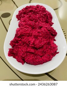 Presentation of red beet on a white plate