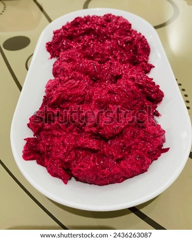 Presentation of red beet on a white plate