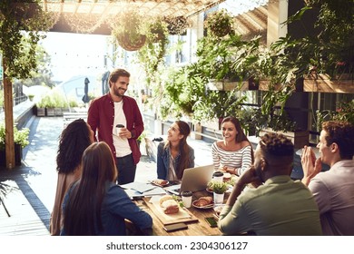 Presentation, restaurant and business people in lunch meeting for discussion, planning and group work. Coffee shop, teamwork and men and women talking for team building, collaboration and ideas - Powered by Shutterstock