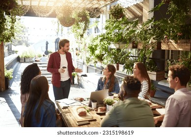 Presentation, restaurant and business people in meeting for discussion, planning and communication. Coffee shop, teamwork and men and women talking for team building, collaboration and project ideas - Powered by Shutterstock