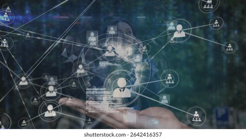 Presenting adult woman wearing blazer holding holographic projection at demo, showing user icons. Technology, innovation, networking, digital, futuristic, interface, data - Powered by Shutterstock - Get 15% off with code: PIKWIZARD15