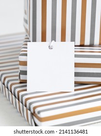 Presents With Blank Square Gift Tag Close Up. Gift Boxes Wrapped In Striped Geometric Paper. Christmas, New Year, Birthday, Anniversary Label Mockup