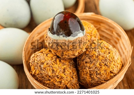 preserved duck eggs or Century egg on wood background