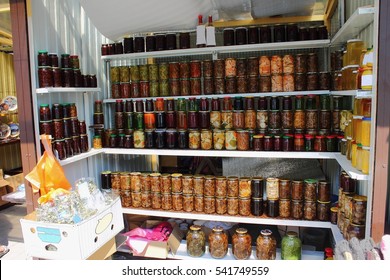 Preserved Food In Glass Jars, On A Wooden Shelf. Various Marinaded Food