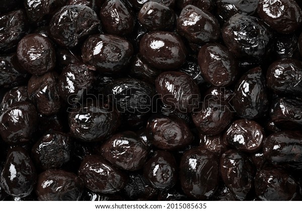 Preserved Moroccan black breakfast olives\
close up full frame as a\
background