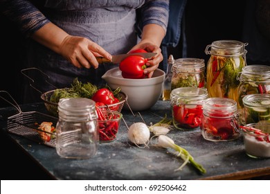 Preserved Red Bell Peppers Process Fermented In Glass Jars Kitchen Table Hand Vegetarian Canning Food Concept 