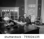 President Calvin Coolidge at the same desk used by Harding in the Oval Office. Photo was published on Aug. 14, 1923, less than two weeks after the death of Warren Harding. Florence Harding was upset t
