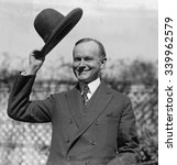 President Calvin Coolidge waves a hat presented to him by Smoki People of Prescott, Arizona. Ca. Sept-Oct. 1924
