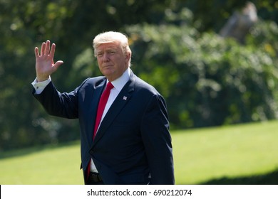 President Donald Trump walks from the west wing of the White House to Marine One before heading to Joint Base Andrews and on to Bedminster, NJ, Friday, August 4, 2017.