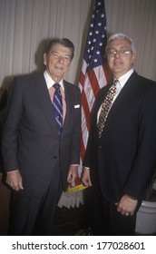 President Ronald Reagan And A Politician Posing