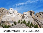 Presidential sculpture at Mount Rushmore national memorial, USA. Sunny day, blue sky.