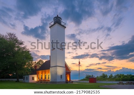Presque Isle Lighthouse in  Erie, Pennsylvania, USA at dusk.