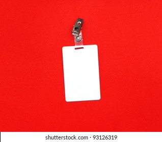 Press Badge Or ID Pass With Clip Isolated On Red Background