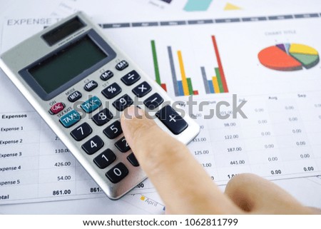 Press Calculator On Chart Graph Paper Stock Photo Edit Now Press Calculator On Chart Graph Paper Stock Photo Edit Now