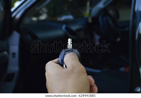press the car\
key remote to open the car\
door.