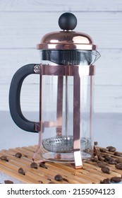 Press Coffee Maker, Under Pressure To Make Fresh Coffee, Bronze Color On Gray Background