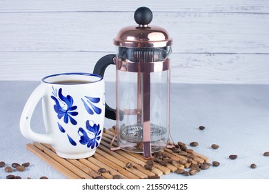 Press Coffee Maker, Under Pressure To Make Fresh Coffee, Bronze Color On Gray Background