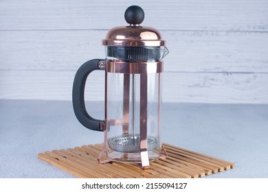 Press Coffee Maker, Under Pressure To Make Fresh Coffee, Bronze Color On Gray Background