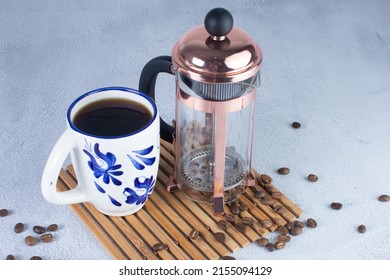 Press Coffee Maker, Under Pressure To Make Fresh Coffee, Bronze Color On Gray Background