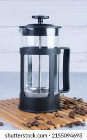 Press Coffee Maker, Under Pressure To Make Fresh Coffee, Bronze Color On Gray Background