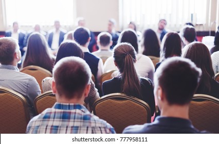 Press Conference Of Head Management CEO In Corporation For Personal. Adult Students Listen To Speaker. Lecture In Small Class Room. Back View.