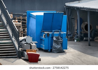 Press Container waste Compactor machine for Reducing Volume in yard of large hypermarket mall. Press Container Compactor for Reducing Volume of Municipal and Industrial Waste. Waste recycling concept.