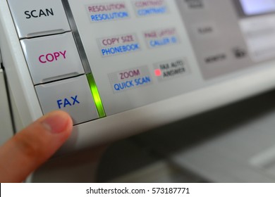 Press fax button and LED lighting on a fax machine