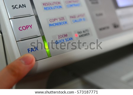 Press fax button and LED lighting on a fax machine