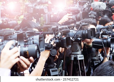 press and media  photographer on duty in public news coverage event for reporter and mass communication - Shutterstock ID 257412721