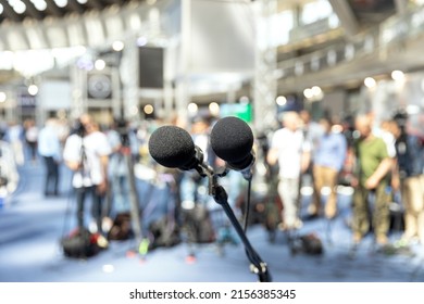 Press Or News Conference, Microphone In Focus At Media Event