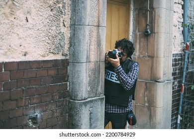 Press Photographer, Wearing A Bulletproof Vest	