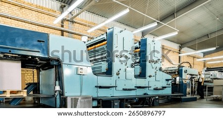 Press printing printshop Offset machine. Offset press is a printing machine designed to produce fine quality reproductions