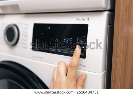 press the start button on the washing machine display, select and switch the washing mode on the touch screen, select the program for the dryer, control the washing machine, select the washing mode