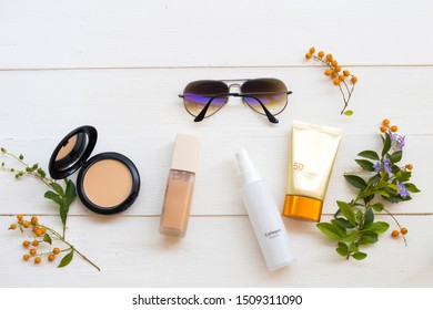 Pressed Powder ,foundation ,sunscreen Spf50 ,collagen Water Cosmetics Beauty Makeup For Skin Face And Sunglasses Of Colorful Lifestyle Woman Relax In Winter Season On White 